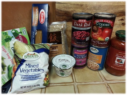 Frozen vegetables, pasta, canned goods on a counter top