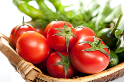 Basket of tomatoes and green peppers